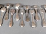 a lot of spoons that are on the table