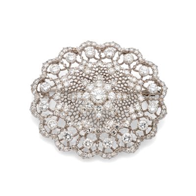 a close up of a diamond broochle on a white background