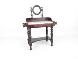 a small desk with a mirror on top of it