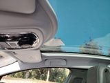 a view of the sunroof from inside of a car
