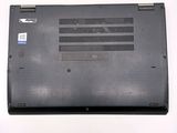 a laptop that is sitting on a white surface