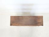 a wooden shelf that is on the floor