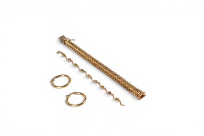 a close up of a pair of brass screws and a pair of rings