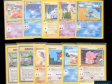 several pokemon cards are lined up on a black surface