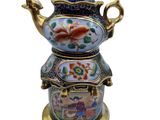 an image of a decorative teapot on a stand