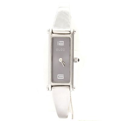 a close up of a wrist watch with a white strap