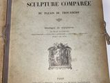 an old book is open on a table with a pair of scissors