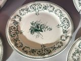 many plates that are sitting on a table