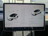 a picture of a car on the screen of a laptop