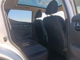 a white truck with the door open and the passenger seat down