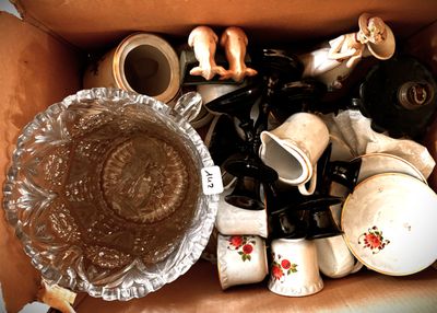 a box full of coffee cups and other items in it