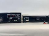 two stereos that are sitting on a table