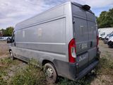 a silver van that is parked in the grass