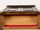 a wooden box with a window on top of a table