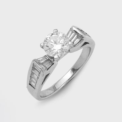 a close up of a diamond ring on a white background
