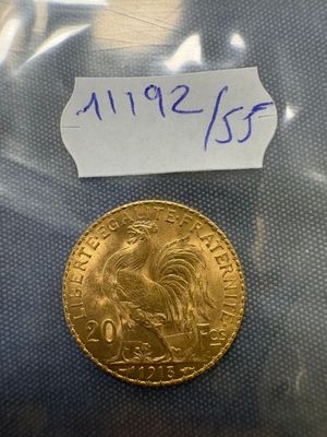 a close up of a gold coin with a label on it