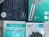 four different types of shower heads and hoses on a table
