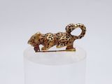 gold plated figurine of a leopard on a clear base
