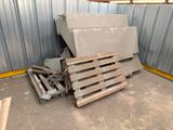 a pile of pallets and a box in a building