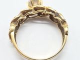 an image of a gold ring with a diamond on top of it