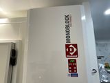 a picture of a white box with a red arrow on it hanging from the ceiling