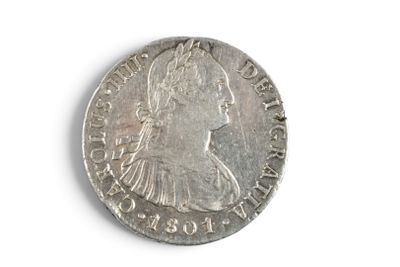 an old silver coin with a woman ' s face on it