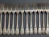 six silverplated spoons and a set of six forks