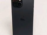 an apple iphone is sitting on a stand on a white surface