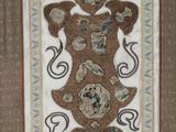 a picture of a brown and blue rug with a bear on it