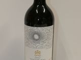 a bottle of wine that is sitting on a table