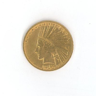 une pièce d'or sur laquelle est représentée une tête d'Indien
