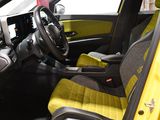 a yellow car with black seats and a steering wheel
