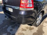 a black car that is parked in a parking lot