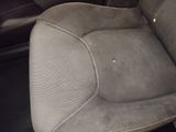 a picture of the inside of a car with the seat up