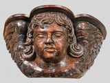 a statue of an angel with wings on it ' s head