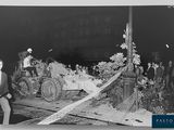 an old black and white photo of a horse drawn carriage being pulled by a man