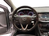 the interior of a car with a steering wheel and dashboard controls