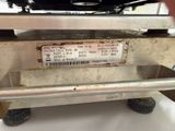 a label on the back of a machine that is sitting on a table