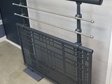 a black radiator sitting next to a window in a room