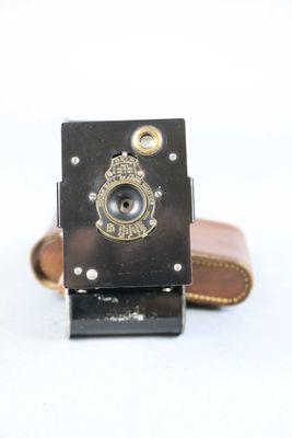 a small camera with a leather case on it