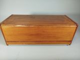 a wooden box with a lid on a white background
