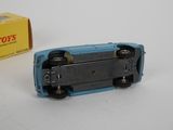 a toy car that is sitting next to a box of toys