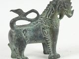 a bronze statue of a horse on a white background
