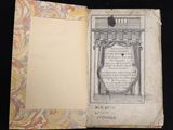 an open book with a drawing of a building on it