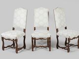 four antique chairs with white upholstered upholstered seats