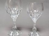 pair of crystal wine glasses on a grey background