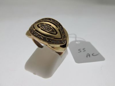 a close up of a gold ring with a tag on it