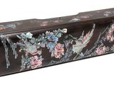 a black case with flowers and birds on it