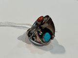 a close up of a silver ring with a turquoise stone in it