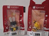 two bags of toys that are sitting on a table